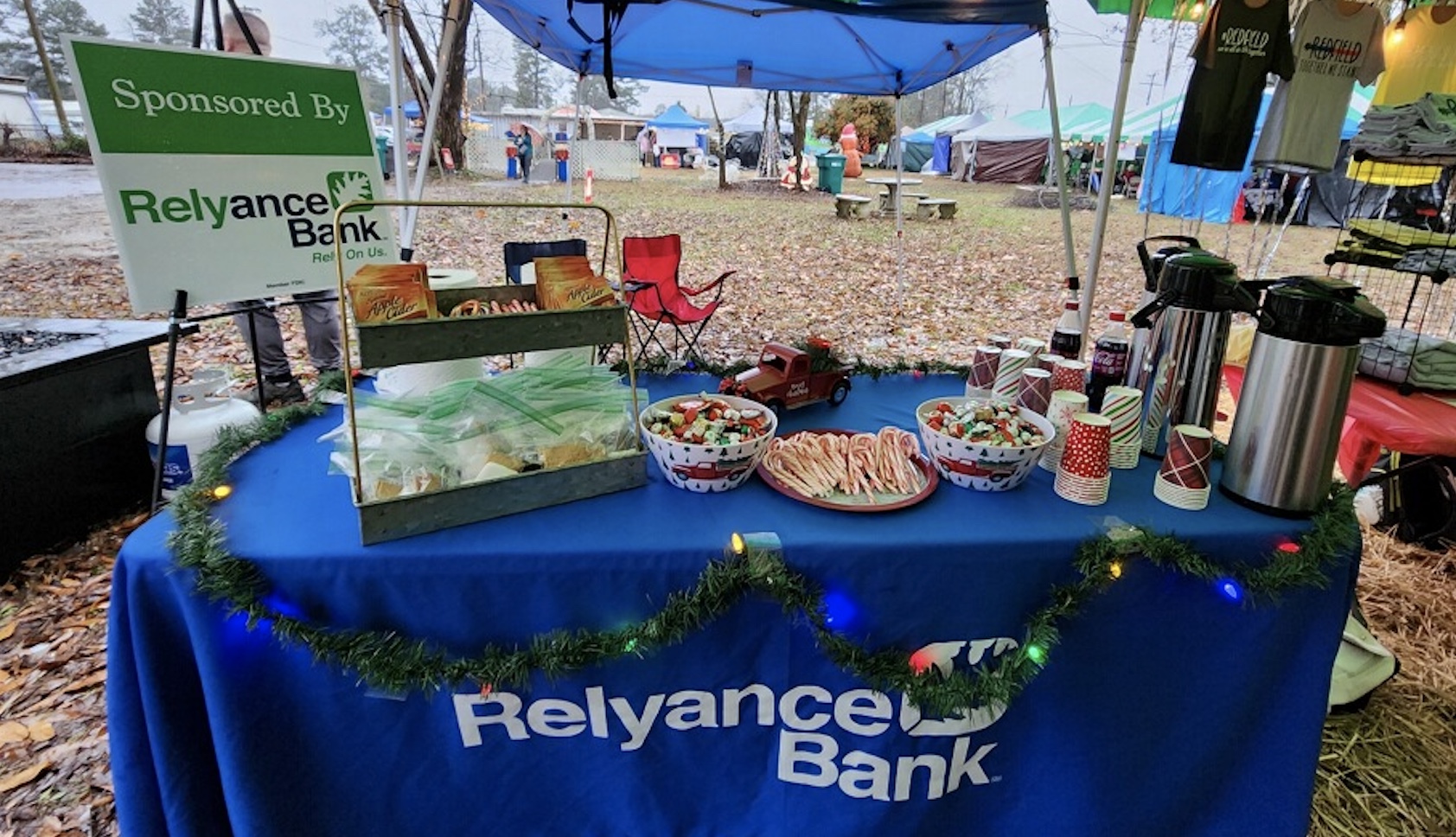 Relyance Bank cider booth at holiday market.